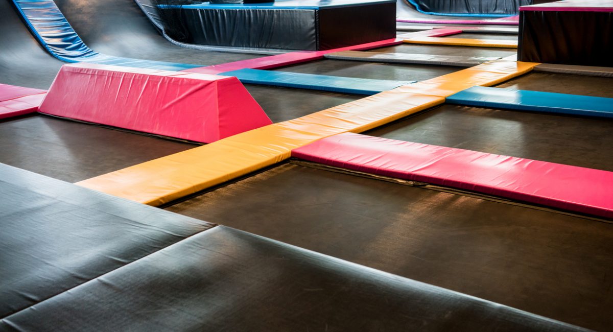 Interconnected trampolines for indoor jumping. New revolution playground and fun activity for all ages.
